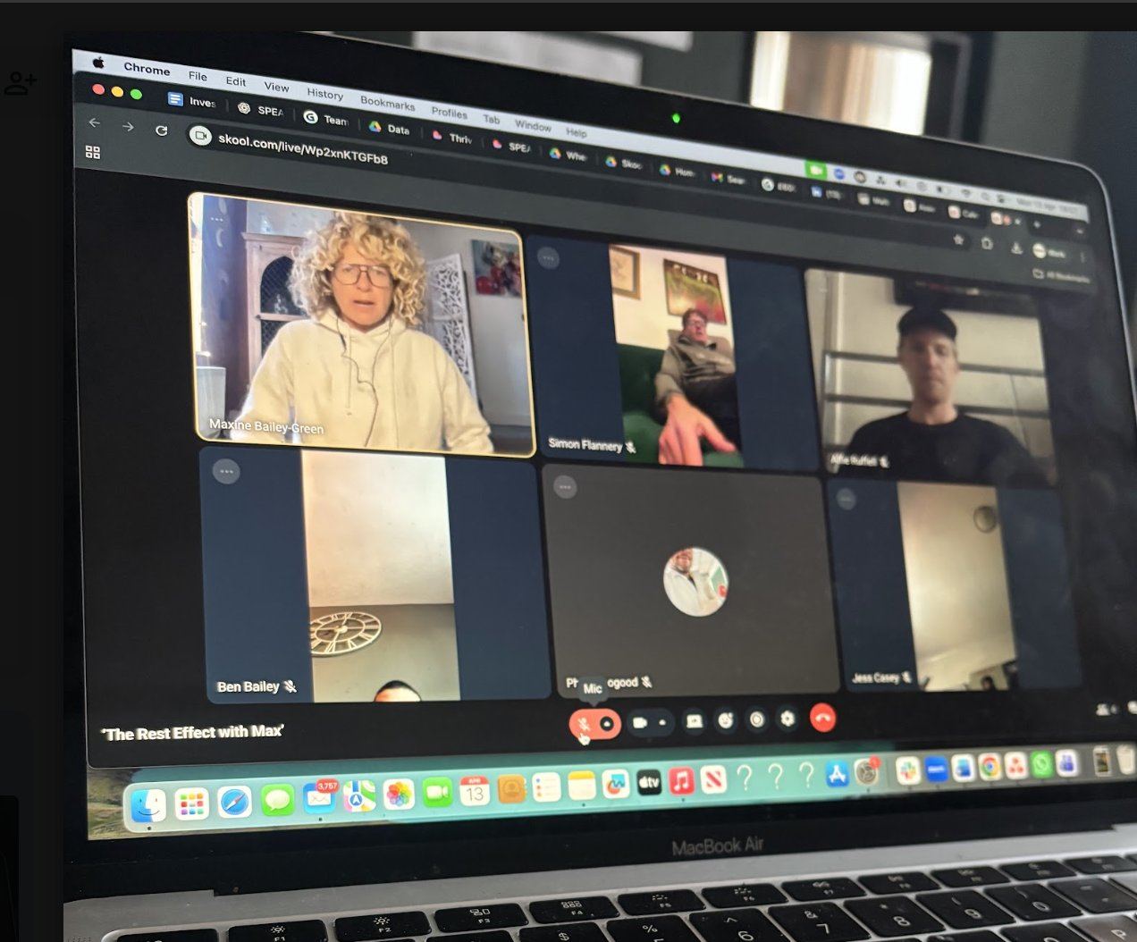 A laptop screen showing a live SPEAK community video session, 'The Rest Effect with Max', with several participants on camera.
